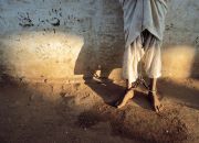 Chained Feet, Sudan Photograph by Reza This Month in Photo of the Day: Images From National Geographic Books "I saw his feet, scarred by chains that also bound his hands. His eyes were resigned, his violence contained."—Reza From the National Geographic book Reza War + Peace, 2009