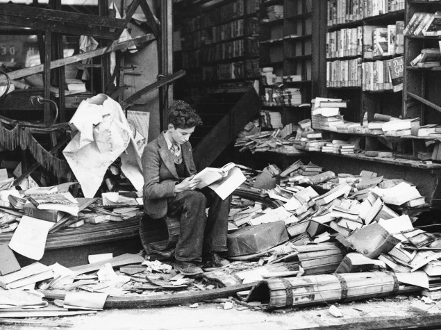 25-A-young-boy-sits-amidst-the-ruins-of-a-London-bookshop-following-an-air-raid-Oct-8-1940-01